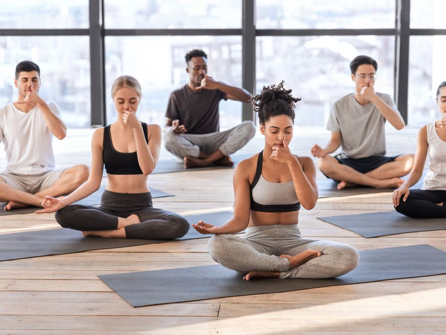 people doing yoga at studio