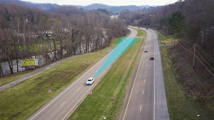 Car driving down a road showing how radar works on a vehicle