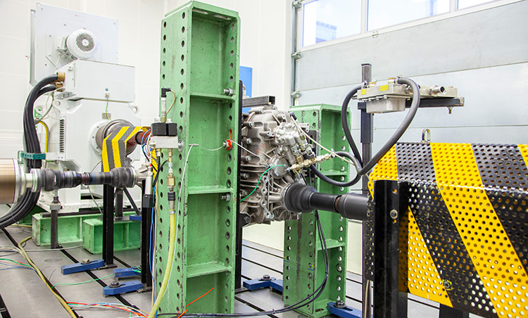 Rear view of grey vehicle taillights on with fog in background