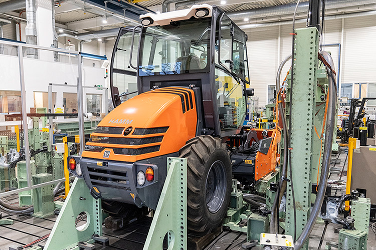 Rear view of grey vehicle taillights on with fog in background