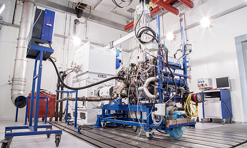 Rear view of grey vehicle taillights on with fog in background