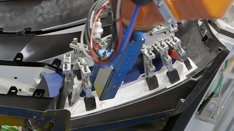 Robotic system joining automotive exterior parts using advanced welding technology