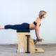 woman doing pilates on a pilates chair